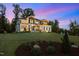 Beautiful home with stone accents, lush lawn, and manicured landscaping at 30 Futrell Ridge Ct, Chapel Hill, NC 27517