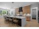 Modern kitchen island with counter seating, stainless appliances, and an open-concept design at 30 Futrell Ridge Ct, Chapel Hill, NC 27517