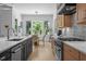 Gourmet kitchen with stainless steel appliances, custom cabinetry, and open breakfast nook at 30 Futrell Ridge Ct, Chapel Hill, NC 27517