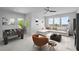 Inviting living room featuring a foosball table, sectional couch and scenic view from the large windows at 30 Futrell Ridge Ct, Chapel Hill, NC 27517