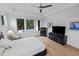 Comfortable bedroom with a ceiling fan, a view of the pool, and ample natural light at 30 Futrell Ridge Ct, Chapel Hill, NC 27517