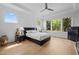 Inviting bedroom with large windows, hardwood floors, ceiling fan, and a modern design at 30 Futrell Ridge Ct, Chapel Hill, NC 27517