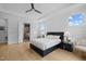 Bright bedroom with hardwood floors, a ceiling fan, and an ensuite bathroom at 30 Futrell Ridge Ct, Chapel Hill, NC 27517