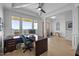 Bright home office with large windows, stylish desk, and comfortable workspace at 30 Futrell Ridge Ct, Chapel Hill, NC 27517