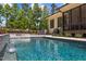 Backyard pool featuring a water feature and lush landscaping, perfect for relaxation at 30 Futrell Ridge Ct, Chapel Hill, NC 27517