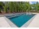 Backyard pool featuring a water feature and lush landscaping, perfect for relaxation at 30 Futrell Ridge Ct, Chapel Hill, NC 27517
