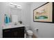Stylish powder room featuring a modern vanity, decorative mirror, and elegant fixtures at 30 Futrell Ridge Ct, Chapel Hill, NC 27517