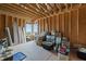 Unfinished storage room under construction with exposed framing and some construction supplies at 30 Futrell Ridge Ct, Chapel Hill, NC 27517