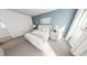 Inviting bedroom featuring a white bed, blue accent wall, and dual windows that provide natural light at 328 Beacon Dr, Pittsboro, NC 27312