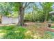Expansive backyard featuring a storage shed, mature trees, and ample space for recreation at 331 Highland Ave, Burlington, NC 27217