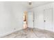 White paneling in this bedroom offers a simple backdrop, featuring a doorway and carpeted floors at 331 Highland Ave, Burlington, NC 27217