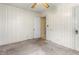 Bedroom showcasing white paneling, a doorway, and a ceiling fan at 331 Highland Ave, Burlington, NC 27217