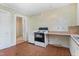 Kitchen featuring laminate countertops, simple cabinetry, and tile floors at 331 Highland Ave, Burlington, NC 27217