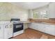 Kitchen featuring laminate countertops and simple cabinetry at 331 Highland Ave, Burlington, NC 27217