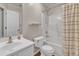 This bathroom features a shower-over-tub and a white vanity with modern fixtures at 3608 Deering Dr, Raleigh, NC 27616