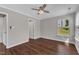 Relaxing bedroom features hardwood floors, ceiling fan, and a view of the outdoors at 3608 Deering Dr, Raleigh, NC 27616
