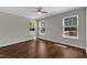 Spacious bedroom with ample natural light from three windows and a modern ceiling fan at 3608 Deering Dr, Raleigh, NC 27616