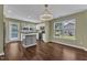 Bright kitchen featuring white cabinets, stainless steel appliances, and an eat-in area at 3608 Deering Dr, Raleigh, NC 27616