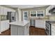 Well-equipped kitchen featuring stainless appliances, a central island, and ample counter space at 3608 Deering Dr, Raleigh, NC 27616
