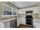 Well-lit kitchen featuring modern appliances, generous countertop space, and a cozy, welcoming ambiance at 3608 Deering Dr, Raleigh, NC 27616