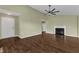 Bright living room featuring wood floors, a fireplace, and high ceilings at 3608 Deering Dr, Raleigh, NC 27616