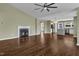 Open-concept living room with fireplace flowing into the kitchen and dining area at 3608 Deering Dr, Raleigh, NC 27616