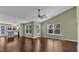 Living room leading into a modern kitchen with an island and pendant lighting at 3608 Deering Dr, Raleigh, NC 27616