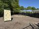 Community playground with climbing wall and swings offers recreational opportunities for families to socialize and have fun at 3608 Deering Dr, Raleigh, NC 27616