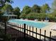 Community pool area provides residents a refreshing oasis with ample seating for relaxation and socialization on sunny days at 3608 Deering Dr, Raleigh, NC 27616