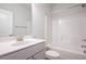 Bright bathroom features a tub with shower and vanity with white countertops at 37 Shoreline Dr, Lillington, NC 27546