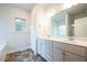 Bathroom featuring double vanity with marble countertop and sleek fixtures at 37 Shoreline Dr, Lillington, NC 27546