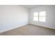 Cozy bedroom with neutral carpet and a large window allowing natural light at 37 Shoreline Dr, Lillington, NC 27546
