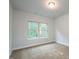 Cozy bedroom with neutral carpet and ample natural light from large window at 37 Shoreline Dr, Lillington, NC 27546