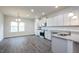 Open concept kitchen with stainless appliances, granite counters, and eat-in area at 37 Shoreline Dr, Lillington, NC 27546