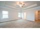 Spacious main bedroom with tray ceiling, ceiling fan, and neutral carpeting at 37 Shoreline Dr, Lillington, NC 27546