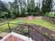 Private backyard featuring a shed, seating, a garden, and a well-maintained lawn at 3725 Fernwood Dr, Raleigh, NC 27612