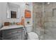 Bathroom featuring a vanity and a full walk-in shower with marble style tile at 3725 Fernwood Dr, Raleigh, NC 27612