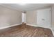 Bedroom featuring hardwood floors, neutral wall paint, and white baseboard molding at 3725 Fernwood Dr, Raleigh, NC 27612