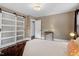 Bedroom featuring a sliding door closet, and a stylish decorative lighting fixture at 3725 Fernwood Dr, Raleigh, NC 27612