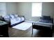 Bedroom featuring hardwood floors, natural lighting, and two metal frame beds at 3725 Fernwood Dr, Raleigh, NC 27612