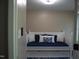 Bedroom featuring a daybed, natural lighting, and neutral colored wall paint at 3725 Fernwood Dr, Raleigh, NC 27612