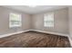Bedroom featuring hardwood floors, natural lighting, and neutral colored wall paint at 3725 Fernwood Dr, Raleigh, NC 27612