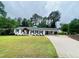 Inviting ranch-style home with a well-manicured lawn, driveway, and attached carport at 3725 Fernwood Dr, Raleigh, NC 27612