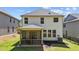 Backyard view of the home featuring a screened porch and an air conditioning unit against the home at 4009 Reunion Creek Pkwy, Apex, NC 27539