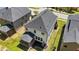 Aerial view of a backyard with a screened porch, lawn, and an air conditioning unit against the home at 4009 Reunion Creek Pkwy, Apex, NC 27539