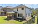 Backyard view of the home featuring a screened porch and an air conditioning unit against the home at 4009 Reunion Creek Pkwy, Apex, NC 27539