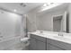 Well-lit bathroom features double sinks, tub, and shower combo with modern fixtures at 4009 Reunion Creek Pkwy, Apex, NC 27539