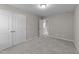 Comfortable bedroom with carpeted floors, double closets, and access to another room at 4009 Reunion Creek Pkwy, Apex, NC 27539