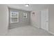 Bedroom with soft carpeting and windows, providing a comfortable and bright space at 4009 Reunion Creek Pkwy, Apex, NC 27539