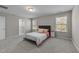 Relaxing bedroom with neutral tones, soft carpet, and natural light streaming through the windows at 4009 Reunion Creek Pkwy, Apex, NC 27539